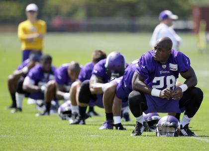 Adrian Peterson is on paid leave until his legal case reaches a resolution. (AP) 