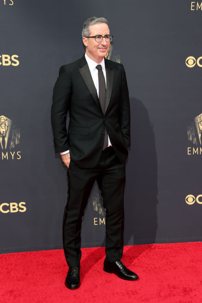 John Oliver on the red carpet in a classic black suit