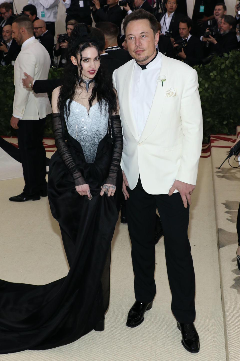 NEW YORK, NY - MAY 07:  Grimes and Elon Musk attend "Heavenly Bodies: Fashion & the Catholic Imagination", the 2018 Costume Institute Benefit at Metropolitan Museum of Art on May 7, 2018 in New York City.  (Photo by Taylor Hill/Getty Images)