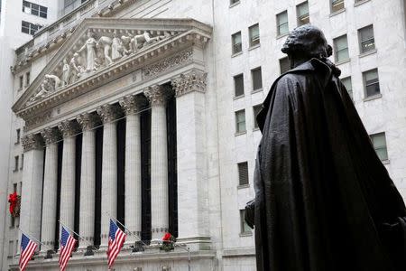 A statue of George Washington stands across from the New York Stock Exchange in Manhattan, New York City, U.S., December 21, 2016. REUTERS/Andrew Kelly