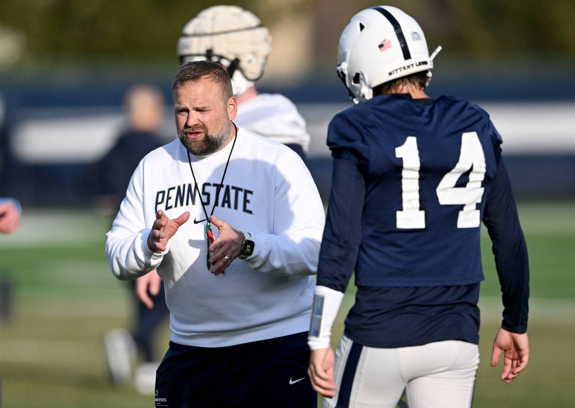 Penn State offensive coordinator Andy Kotelnicki talks to quarterback Jaxon Smolik during spring practice on March 12.