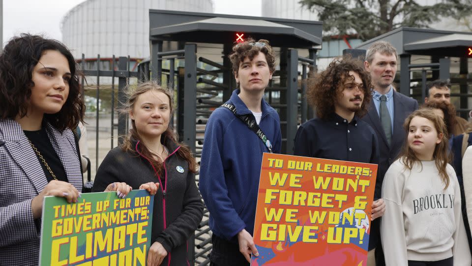 Swedish climate activist Greta Thunberg, second left, joins youths from Portugal during a demonstration outside the European Court of Human Rights on Tuesday in Strasbourg, France. - Jean-Francois Badias/AP