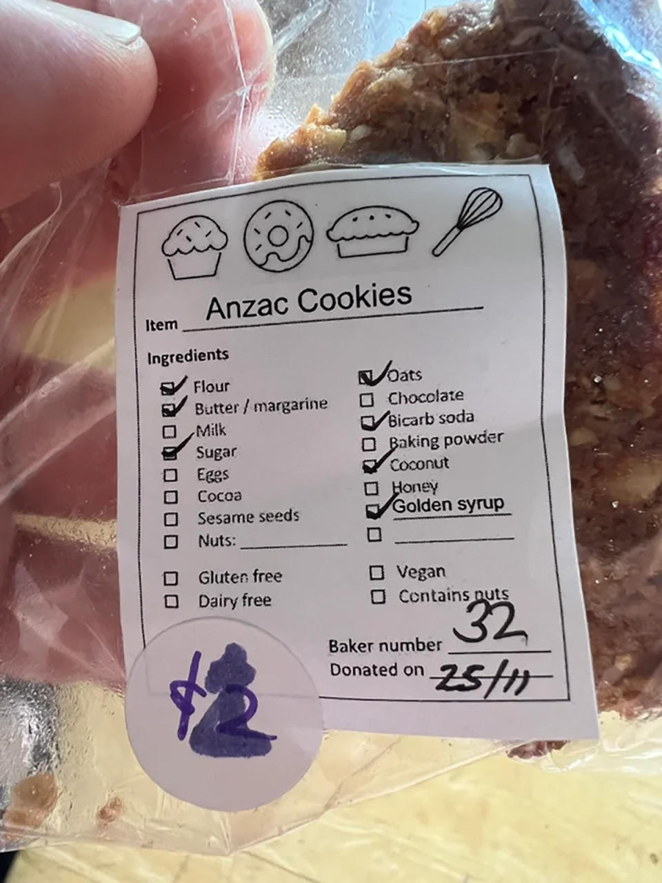 A packet of homemade Anzac biscuits with a label reading, 'Anzac cookies'