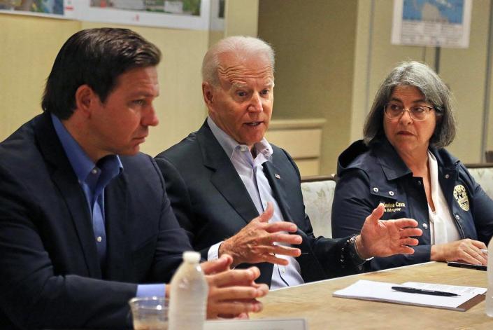 President Joe Biden during a meeting with officials at the St. Regis Hotel on Thursday, July 1, 2021, after the collapse of the Champlain Towers South Condominium in Surfside. Florida Governor Ron DeSantis (L) and Miami-Dade Mayor Daniella Levine Cava (R) are seated with the president.