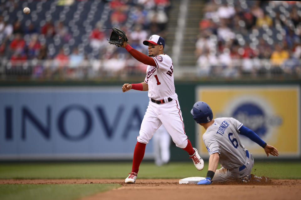 Los Angeles Dodgers' Trea Turner (6) steals second against Washington Nationals second baseman Cesar Hernandez (1) during the inning of a baseball game, Wednesday, May 25, 2022, in Washington. (AP Photo/Nick Wass)