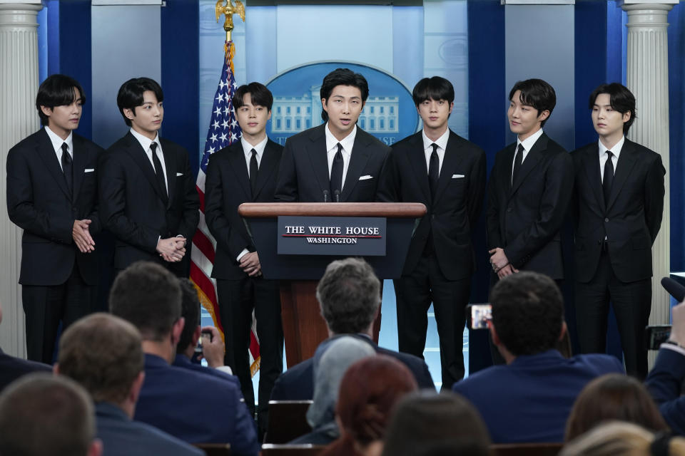 FILE - RM, center, accompanied by other K-pop supergroup BTS members from left, V, Jungkook, Jimin, Jin, J-Hope, and Suga speaks during the daily briefing at the White House in Washington, Tuesday, May 31, 2022. South Korea’s military appears to want to draft members of the K-pop supergroup BTS for mandatory military duties, as the pubic are sharply divided over whether they must be exempted from the service. (AP Photo/Evan Vucci, File)