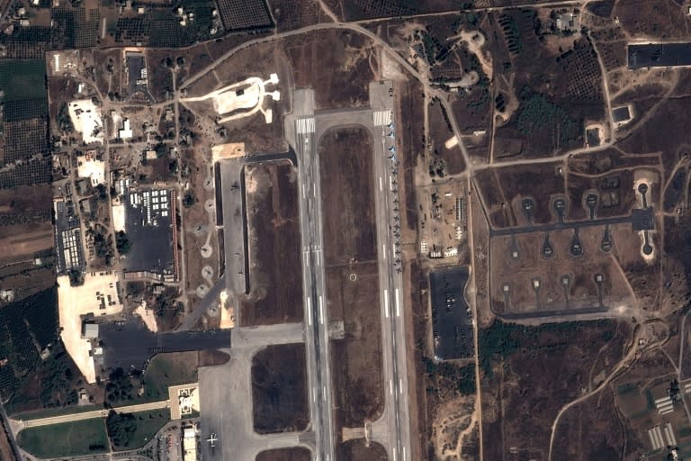 This image taken by EADS' Astrium Press on September 20, 2015 by Pleiades Satellite shows a view of Russian fighter jets and helicopters at a military base in the government-controlled coastal Syrian city of Latakia