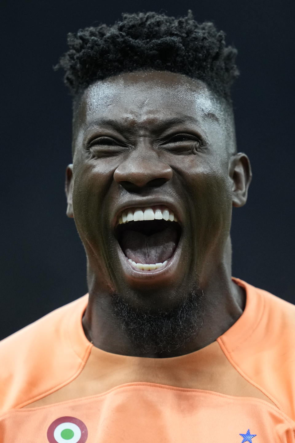 Inter Milan's goalkeeper Andre Onana celebrates after Inter Milan's Lautaro Martinez scored his side's opening goal during the Champions League semifinal second leg soccer match between Inter Milan and AC Milan at the San Siro stadium in Milan, Italy, Tuesday, May 16, 2023. (AP Photo/Antonio Calanni)