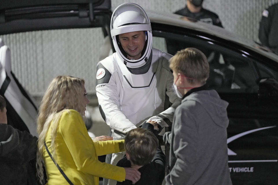 Russian cosmonaut Andrei Fedyaev meets with family members after leaving the Operations and Checkout building for a trip to Launch Pad 39-A, Wednesday, March 1, 2023, at the Kennedy Space Center in Cape Canaveral, Fla. (AP Photo/John Raoux)