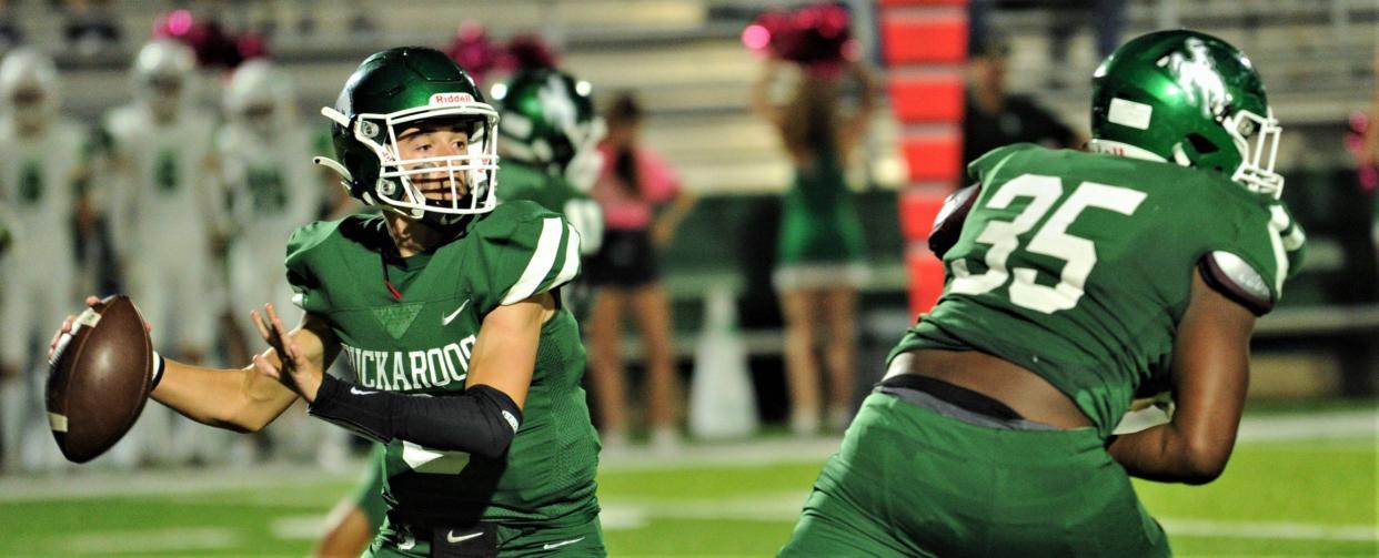 Breckenridge quarterback Chase Lehr, left, looks to throw the ball while running back Jerry Lawson protects him in the second half against Wall last season in Breckenridge. Both are back this season for a Bucks team off to a 2-0 start.