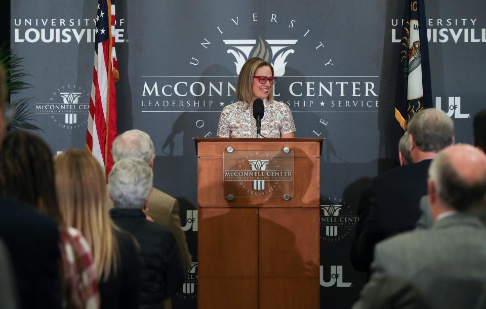 Arizona Sen. Kyrsten Sinema smiled at the conclusion of her remarks about bipartisanship as a guest of Sen. Mitch McConnell during an event at the McConnell Center on the campus of the University of Louisville in Louisville, Ky. on Sept. 26, 2022.  