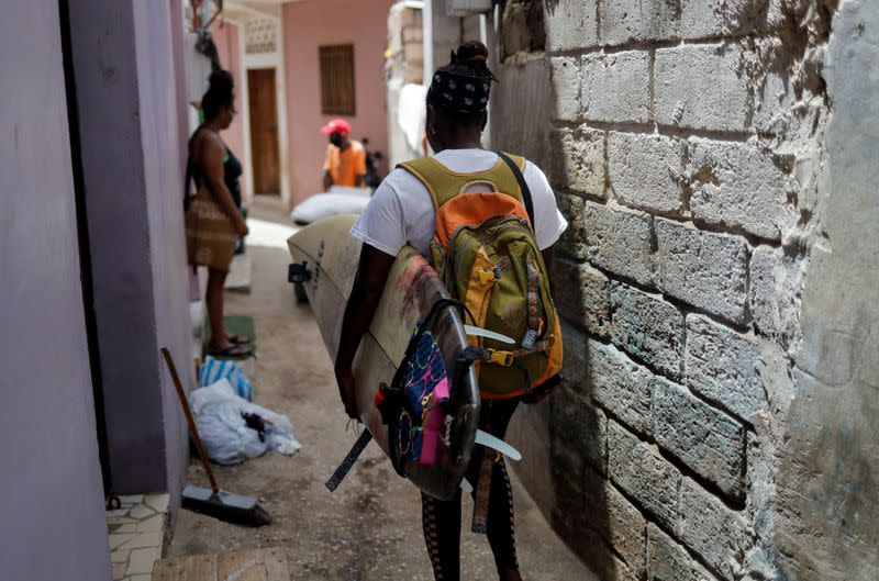 Wider Image: Meet Senegal's first female pro surfer inspiring girls to take to the waves