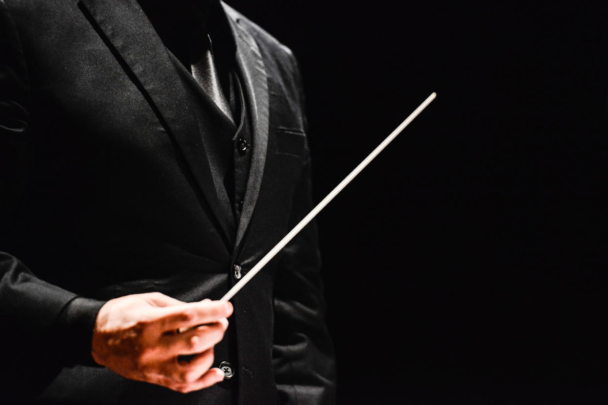 Conductor holding baton - Credit: Lucas Ninno/Getty Images