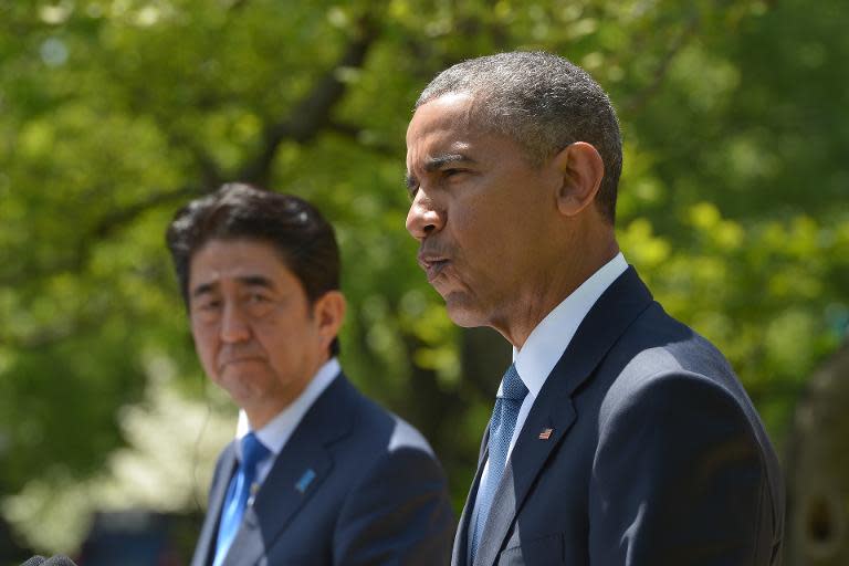 US President Barack Obama and Japanese Prime Minister Shinzo Abe hold a joint press conference in the Rose Garden at the White House on April 28, 2015 in Washington, DC