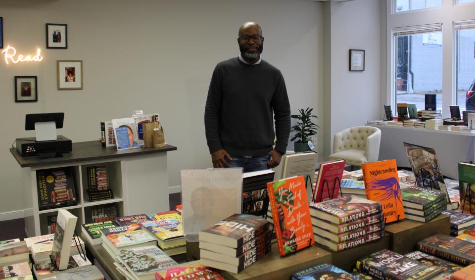 Demetrius Frazier strikes a pose in his new bookstore Resist Booksellers in Petersburg, Va. on Feb. 18.