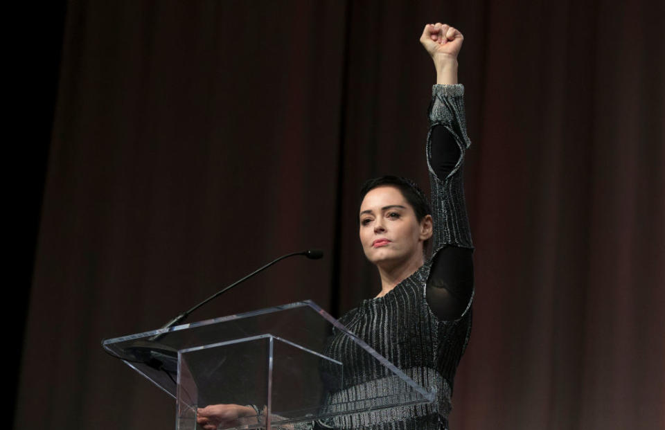 Rose McGowan raises her fist during her opening remarks to the audience at the Women's Convention in Detroit, Mich., on October 27, 2017. (Photo: Rena Laverty/AFP/Getty Images)