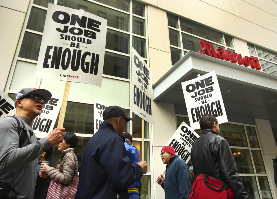 Hotel workers strike in front of a Marriott hotel Thursday, Oct. 4, 2018, in San Francisco. Thousands of housekeepers, cooks and other Marriott hotel workers are on strike in San Francisco and San Jose after months of negotiating for a wage increase. (AP Photo/Ben Margot)