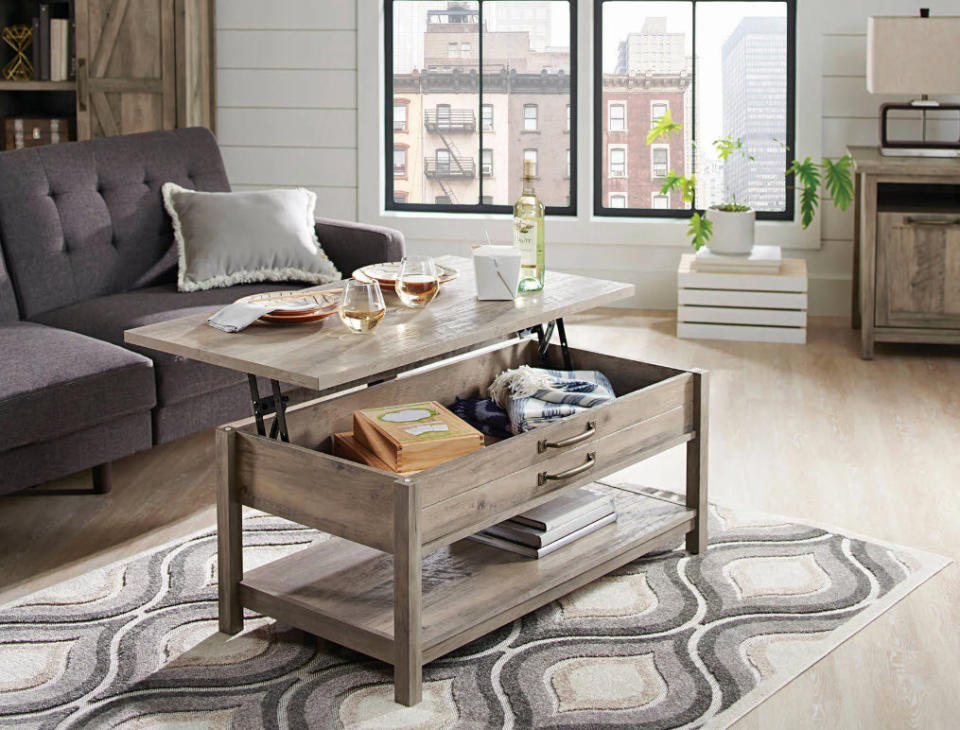 wooden lifting coffee table in living room