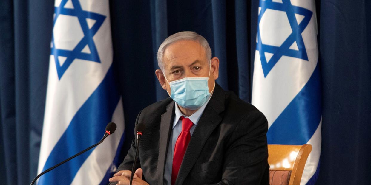 FILE PHOTO: Israeli Prime Minister Benjamin Netanyahu, wearing a protective face mask, attends the weekly cabinet meeting at the Ministry of Foreign Affairs in Jerusalem, June 14, 2020. Sebastian Scheiner/Pool via REUTERS