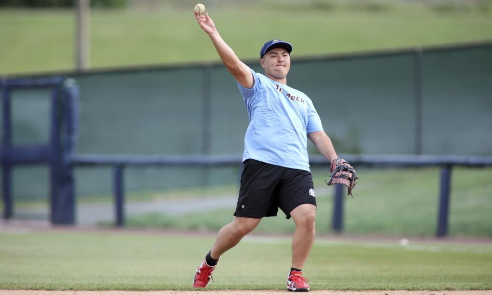 Trenton Thunder first baseman Rintaro Sasaki (49) makes a throw before a baseball game against the Frederick Keys, Tuesday, June 11, 2024 , in Frederick, Md. The 19-year-old prospect will make his U.S. debut Tuesday in the MLB Draft League, playing for the Trenton Thunder of New Jersey along with others hoping to one day develop into major leaguers.(AP Photo/Daniel Kucin Jr.)