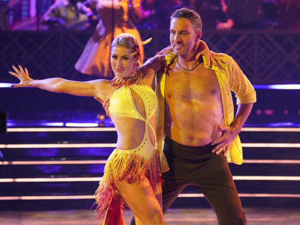 Emma Slater and Mauricio Umansky dancing salsa.