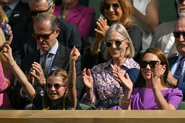 <p>BEN STANSALL/AFP via Getty</p> Princess Charlotte and Catherine, Princess of Wales at Wimbledon 2024