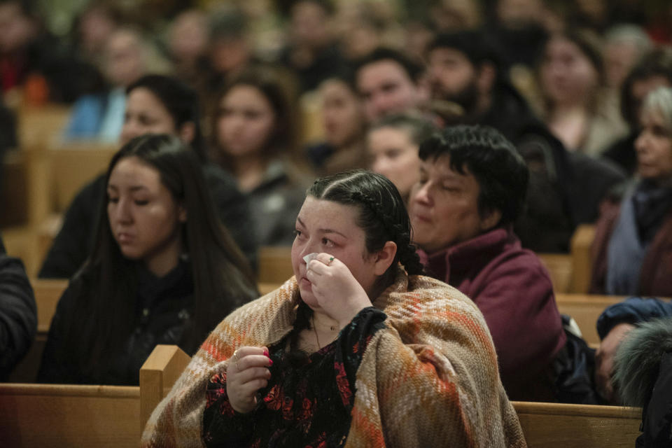 Community members gather and hold a vigil for the six people killed in a plane crash, in Fort Smith, Northwest Territories, on Wednesday, Jan. 24, 2024. (Jason Franson/The Canadian Press via AP)