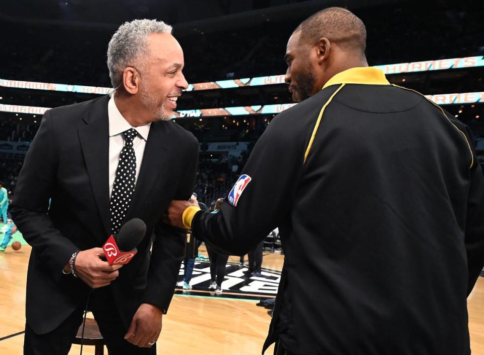 Former Charlotte Hornets guard Dell Curry, left, joke with Golden State Warriors guard Chris Paul prior to the team’s game against the Charlotte Hornets at Spectrum Center in Charlotte, NC on Friday, March 29, 2024. JEFF SINER/jsiner@charlotteobserver.com