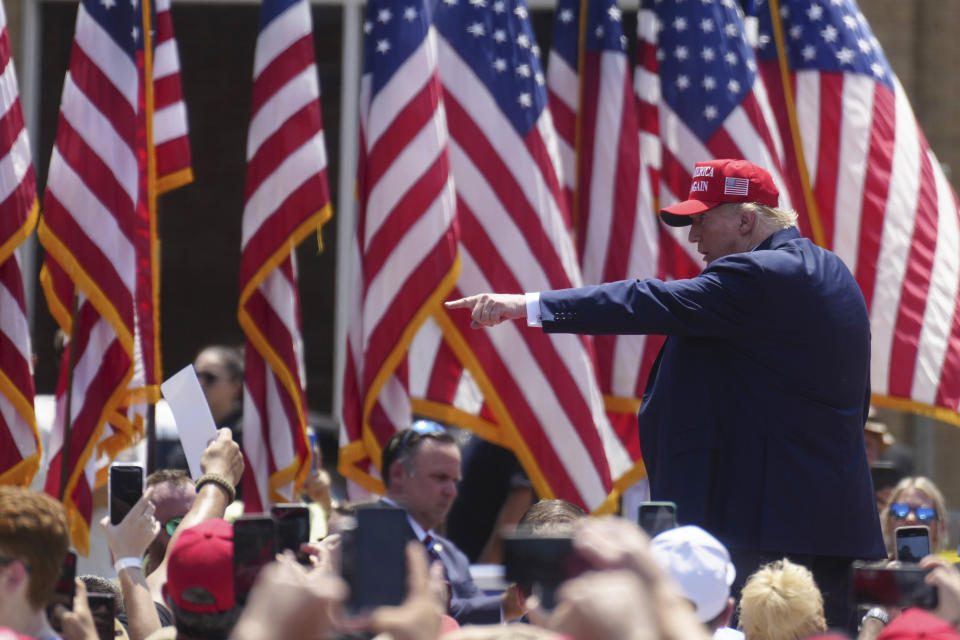 Former President Donald Trump points to supporters after speaking at a campaign rally on Saturday, July 1, 2023, in Pickens, S.C. Thousands were in attendance at the rally in the small city's downtown streets, Trump's first campaign event in the early-voting state since January. (AP Photo/Meg Kinnard)