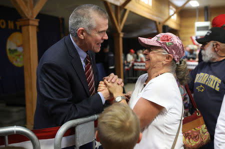 Republican Senate candidate Matt Rosendale meets attendees after a campaign rally in Bozeman, Montana, U.S., October 2, 2018. REUTERS/Jim Urquhart