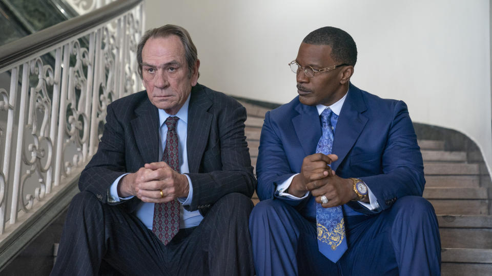 This image released by Amazon Prime video shows Tommy Lee Jones as Jeremiah O'Keefe, left, and Jamie Foxx as Willie Gary in a scene from "The Burial," a film premiering at the Toronto International Film Festival. (Skip Bolen/Amazon Prime Video via AP)