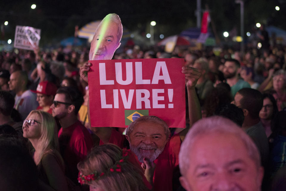 A supporter holds up a sign with a message that reads in Portuguese: "Lula Free" during the Lula Free festival in Rio de Janeiro, Brazil, Saturday, July 28, 2018. Popular Brazilian musicians and social movements organized a concert to call for the release of Brazil's former president Luiz Inacio Lula da Silva, who has been in prison since April, but continues to lead the preferences on the polls ahead of October's election. (AP Photo/Leo Correa)