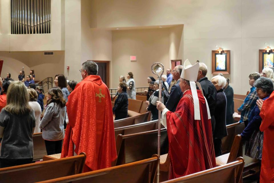 Bishop Patrick Zurek makes his way with the mass procession for Pope Emeritus Benedict XVI Monday at St. Mary's Cathedral in Amarillo.