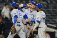 Kansas City Royals designated hitter Ryan O'Hearn (66) greets third baseman Kelvin Gutierrez (19) and first baseman Carlos Santana (41) after the Royals' 6-5 victory over the New York Yankees in a baseball game, Tuesday, June 22, 2021, at Yankee Stadium in New York. (AP Photo/Kathy Willens)