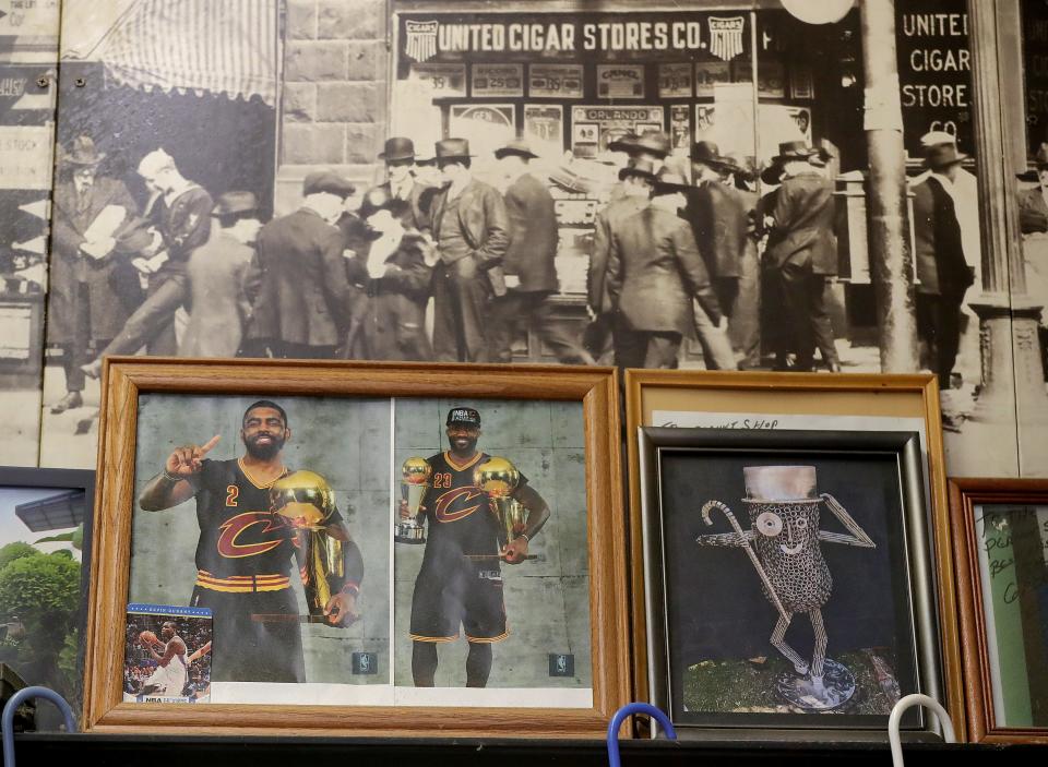 Cleveland Cavaliers championship photos of Kyrie Irving and LeBron James are among the decorations at the Peanut Shoppe in downtown Akron.