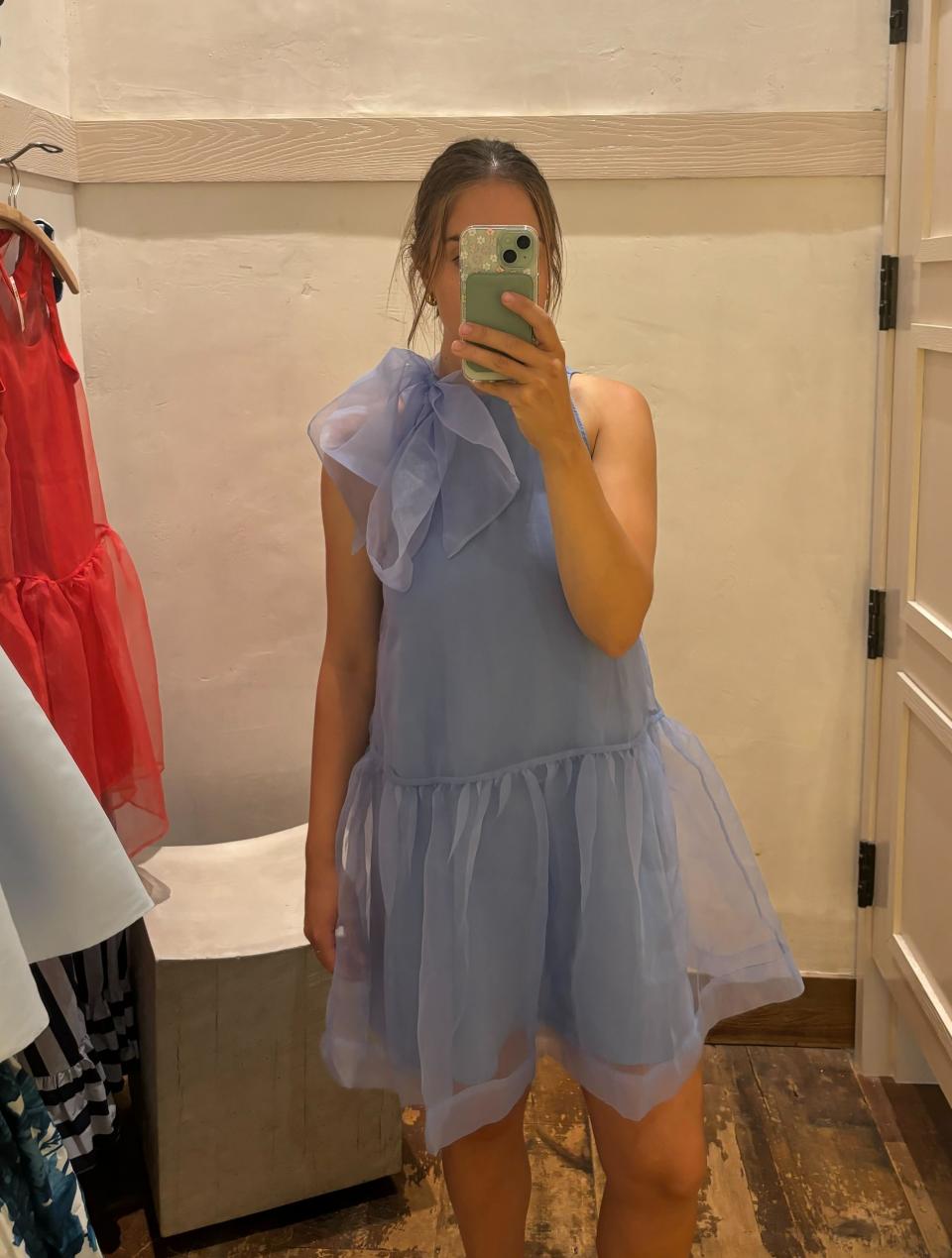 woman wearing organza blue mini dress with neck bow, This organza mini dress is EVERYTHING! (Photo via Kayla Kuefler).