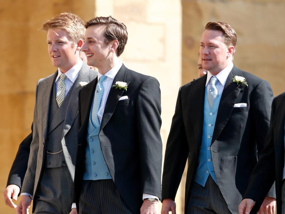 Hugh Grosvenor, Duke of Westminster, Charlie van Straubenzee and Arthur Landon walking together while wearing black suits and light-colored ties.