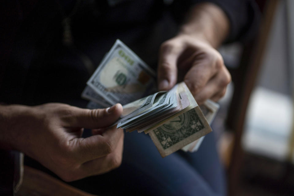 a person counting their money