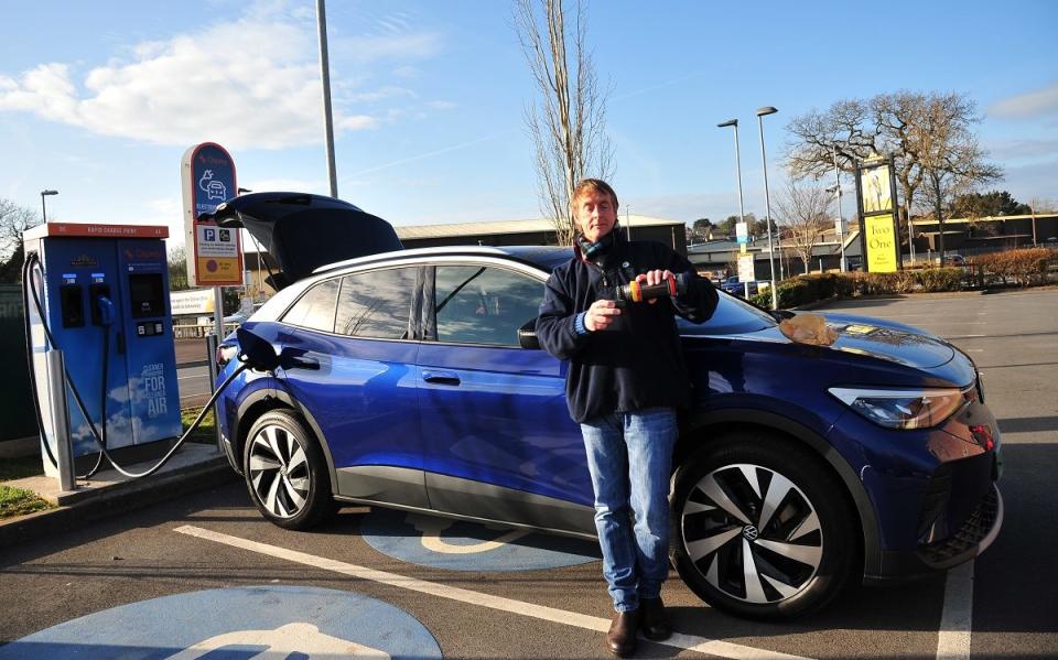 Andrew English has a flask of tea as we waits for a Volkswagen ID.4 electric car to charge