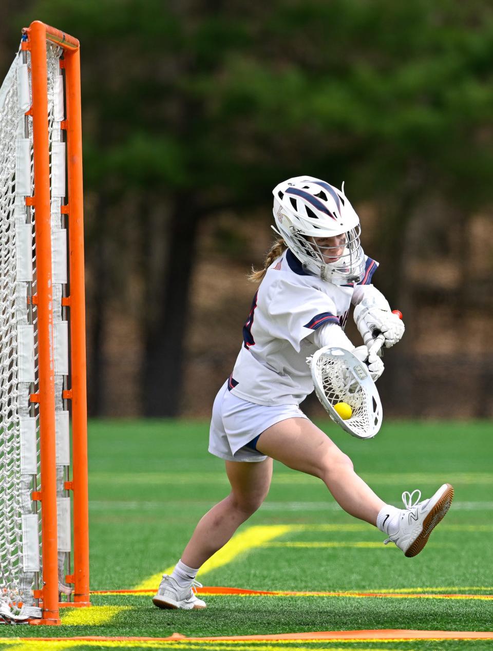 Lincoln-Sudbury goalie junior Lydia Mossi makes a save during a girls lacrosse game at Lincoln-Sudbury High School, Friday, April 19, 2024.