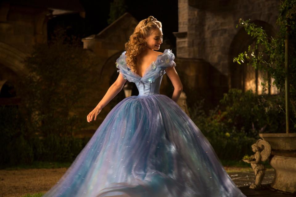 Lily James wears a spiffy ball gown as the title character of "Cinderella."