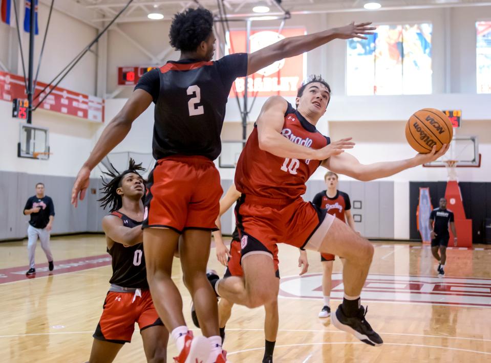 Bradley's Connor Hickman moves to the basket against teammate Emarion Ellis during practice Monday, Oct. 2, 2023 at Renaissance Coliseum on the Bradley University campus in Peoria.