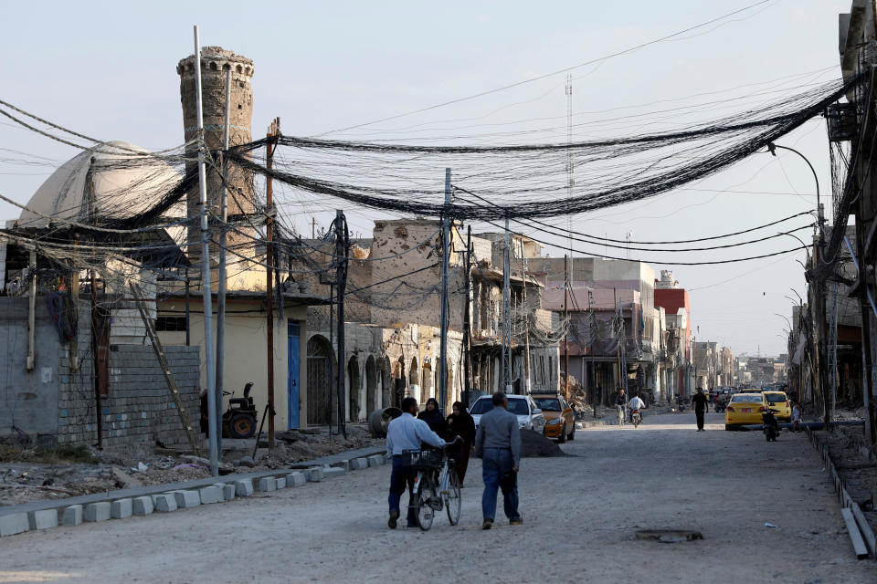 People walk on the street, where Islamic State leader Abu Bakr al-Baghdadi declared his caliphate back in 2014, in the old city of Mosul, Iraq, October 27, 2019. REUTERS/Abdullah Rashid (Photo: Abdullah Rashid / Reuters)