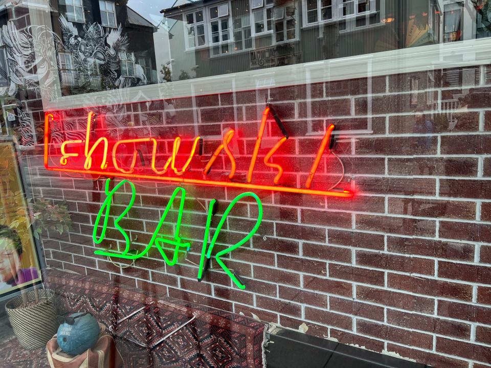A neon sign for Lebowski Bar.