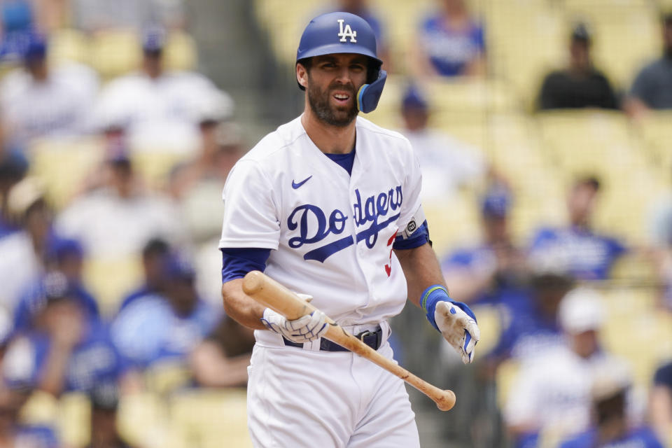 Los Angeles Dodgers' Chris Taylor reacts after striking out during the fifth inning in the first baseball game of a doubleheader against the Miami Marlins, Saturday, Aug. 19, 2023, in Los Angeles. (AP Photo/Ryan Sun)