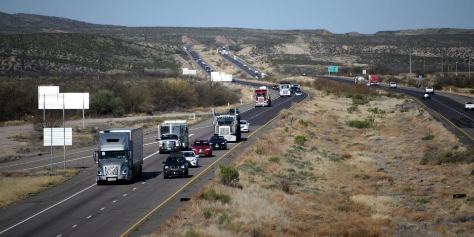 trucks traveling on a highway in Arizona
