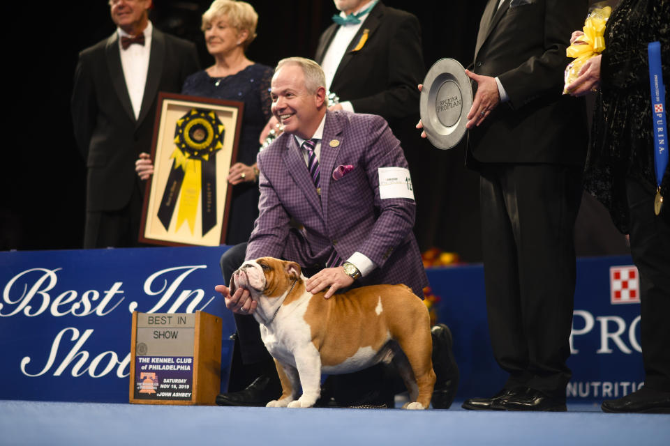 Eduardo Paris, a native of Peru, poses for a group photo as Thor wins the Best in Show on Thursday at the Greater Philadelphia Expo Center. (Photo: Mark Makela via Getty Images)