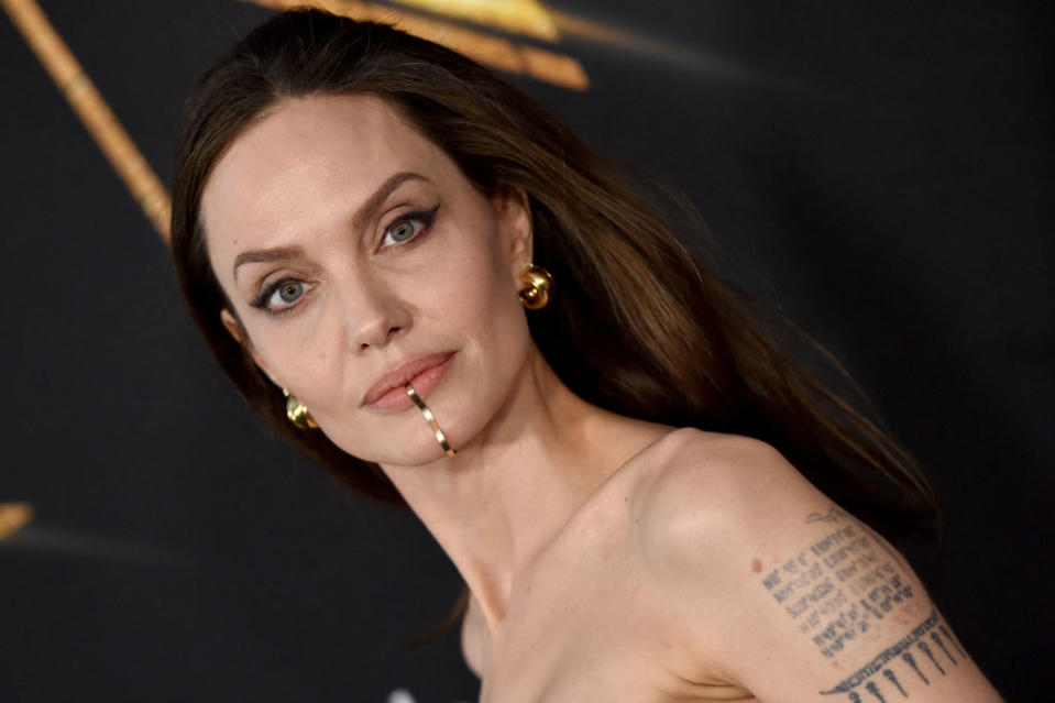 All eyes were on Angelina Jolie's unusual chin cuff at the premiere of Eternals. (Getty Images)