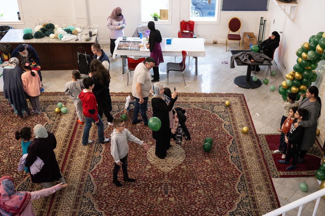 A gathering mingled during the Eid festival held April 13 at the Worcester Islamic Center.