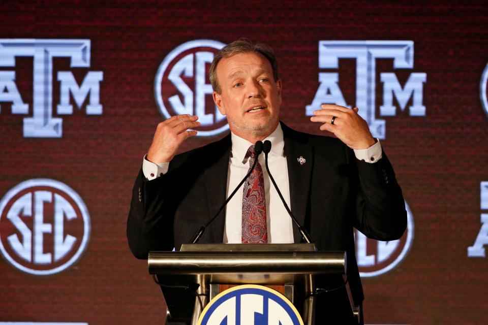 FILE - Texas A&M head coach Jimbo Fisher speaks to reporters during the NCAA college football Southeastern Conference Media Days in Hoover, Ala., July 21, 2021. No. 23 Texas A&M won't play in the Gator Bowl against Wake Forest on Dec. 31 because of COVID-19 issues and season-ending injuries, the team announced Wednesday, Dec. 22, 2021. "It is unfortunate, but we just don't have enough scholarship players available to field a team," Texas A&M coach Jimbo Fisher said in a news release. (AP Photo/Butch Dill, File)